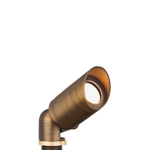 VOLT® Spark mini brass spotlight angled view illuminated.